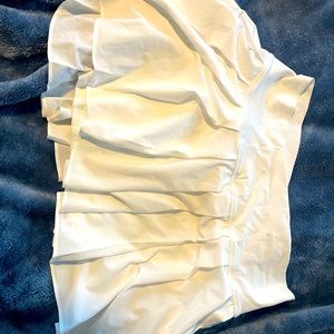 White skirt with shorts underneath never been worn.